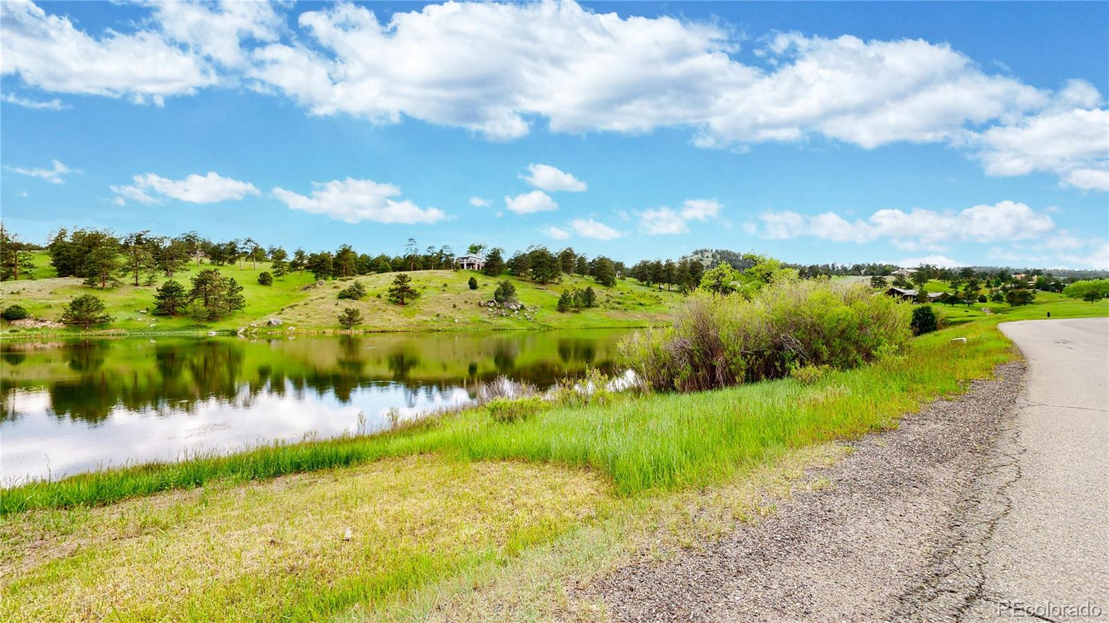 974 Spring Ranch Drive Golden, CO 80401 - Photo 44 of 50 a view of a lake with a city