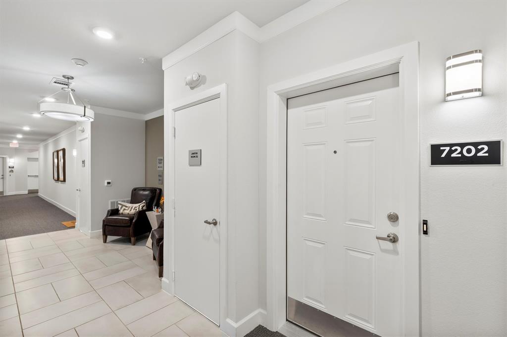 651 Watters Road, Unit 7202 Allen, TX 75013 - Photo 23 of 33 a view of hallway with furniture and a chandelier