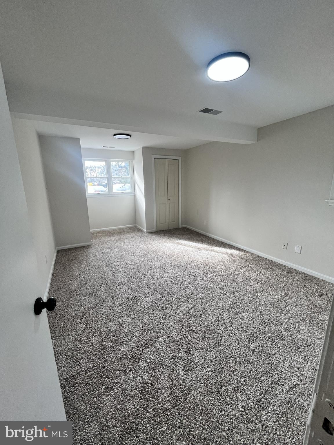 301 Bryan Point Road, Unit B Accokeek, MD 20607 - Photo 5 of 12 an empty room with windows