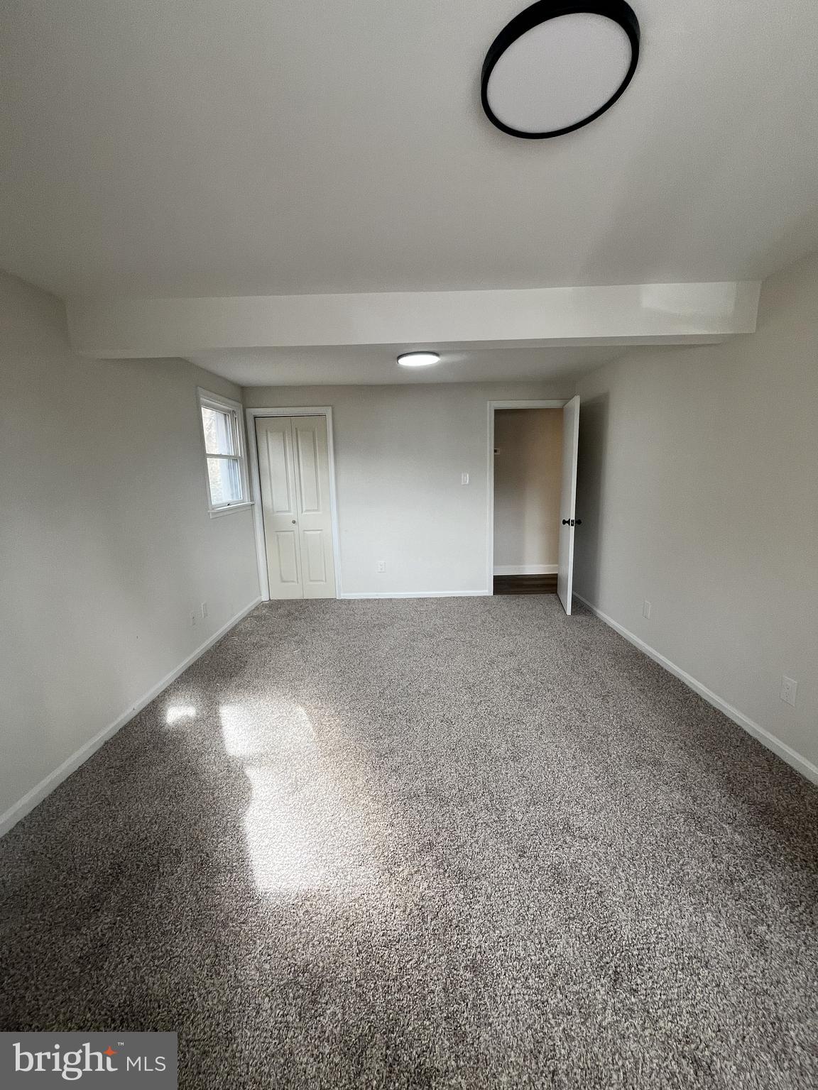 301 Bryan Point Road, Unit B Accokeek, MD 20607 - Photo 6 of 12 a view of empty room with windows