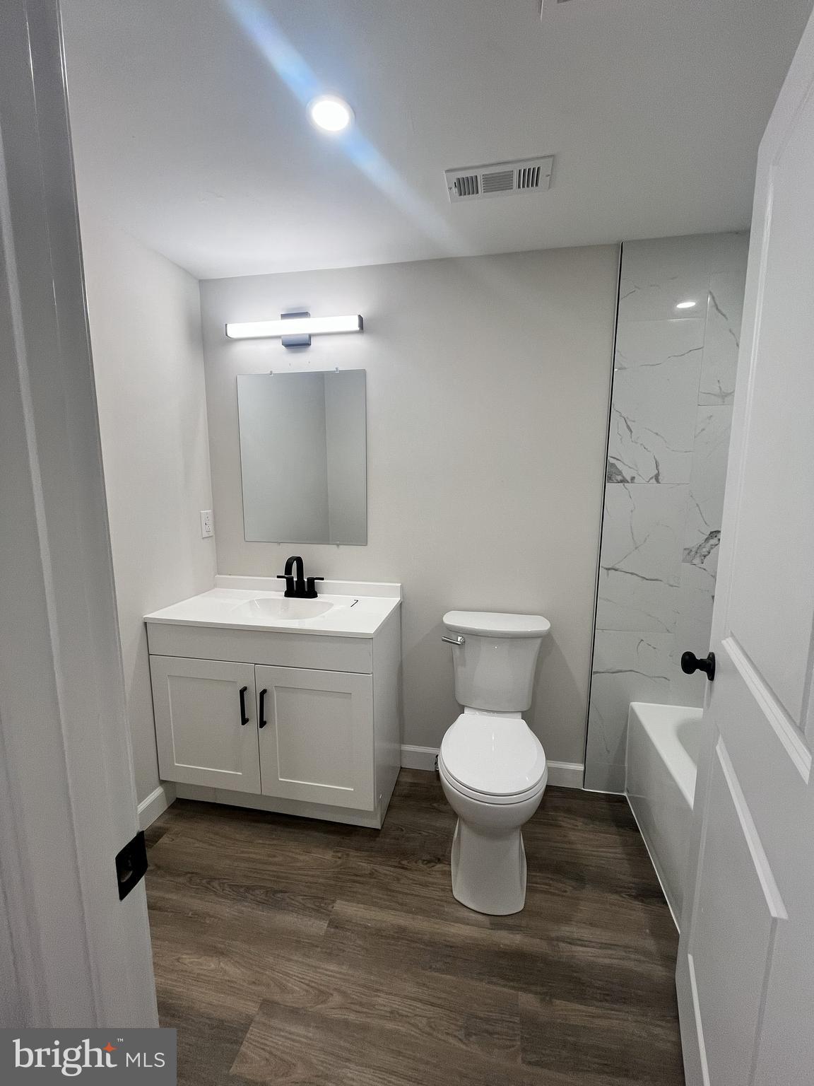 301 Bryan Point Road, Unit B Accokeek, MD 20607 - Photo 8 of 12 a bathroom with a sink toilet and a mirror