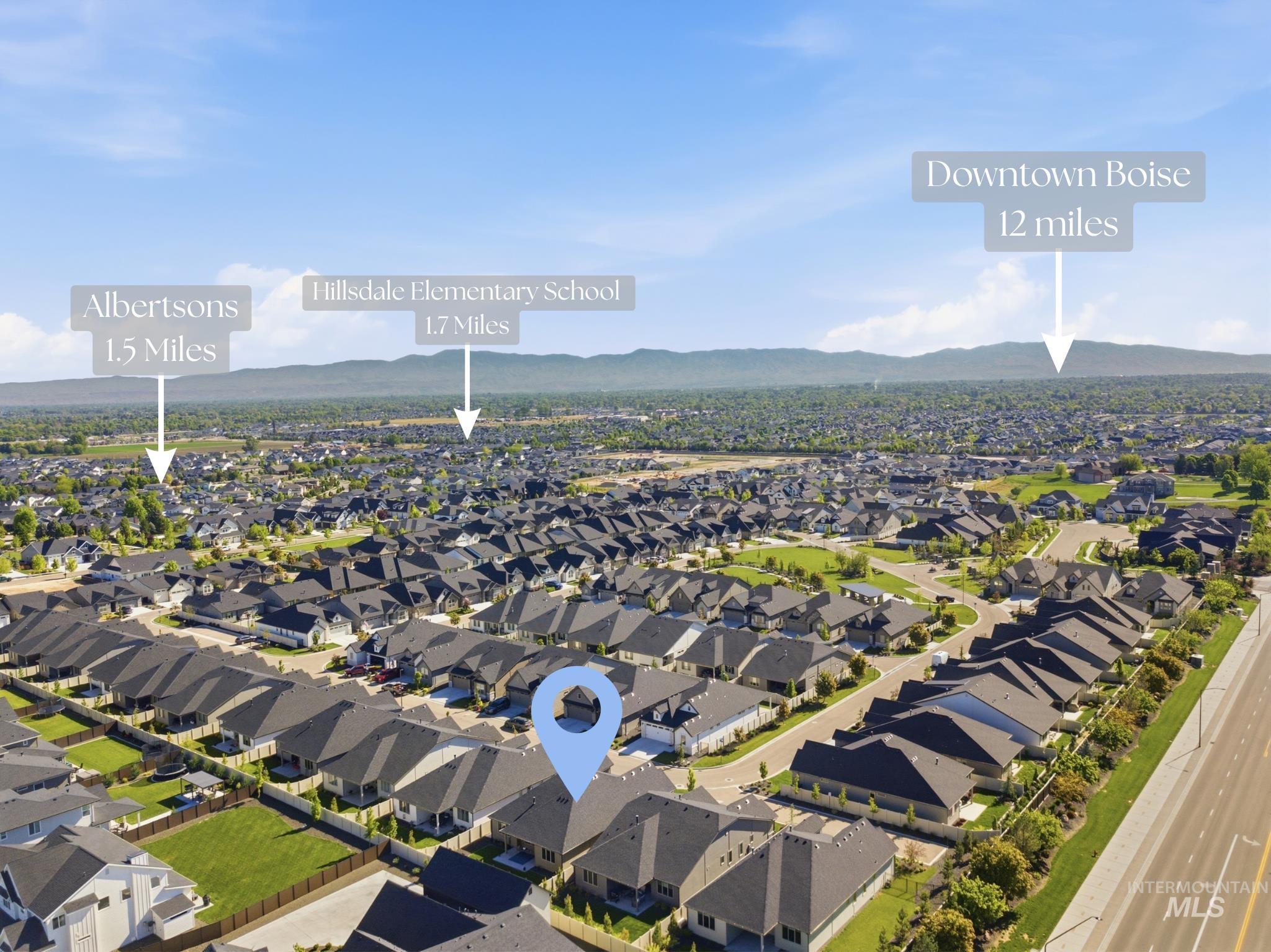 6347 South Utmost Lane Meridian, ID 83642 - Photo 35 of 37 Aerial perspective showcasing a residential neighborhood with distant mountain ranges
