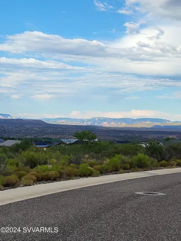 a view of an ocean and a mountain