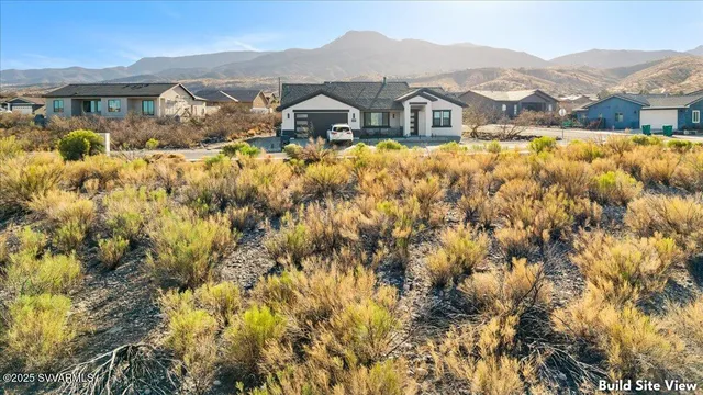 a view of a town with mountains house
