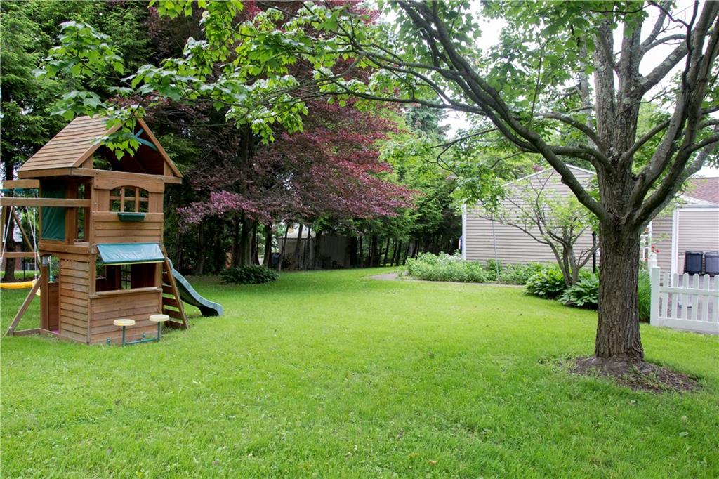 146 Shafer Road Coraopolis, PA 15108 - Photo 23 of 25 Backyard flows into this sizable side yard with a play house.