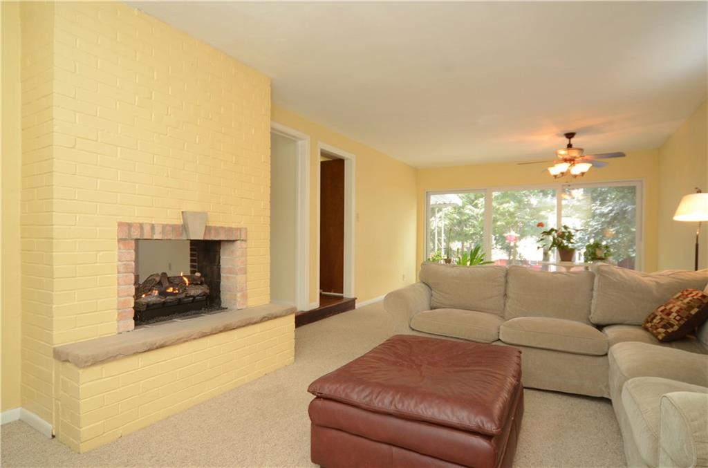 146 Shafer Road Coraopolis, PA 15108 - Photo 9 of 25 Great room space flooded with natural light allows you and your guests to comfortably enjoy the fireplace, dining area and the back porch.