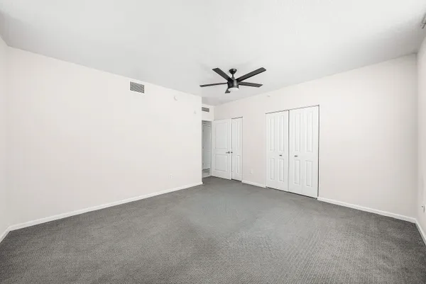 a view of a big room with carpet