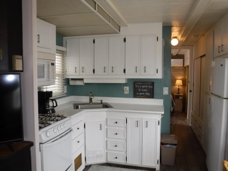 Undisclosed Address Indio, CA 92203 - Photo 13 of 33 a kitchen with stainless steel appliances granite countertop a refrigerator and white cabinets