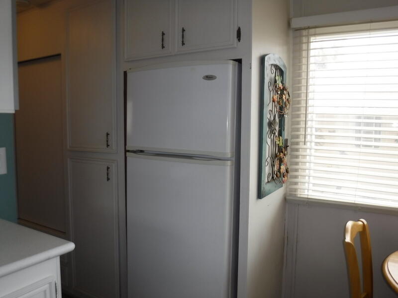 Undisclosed Address Indio, CA 92203 - Photo 14 of 33 a view of a hallway with wooden floor and a window