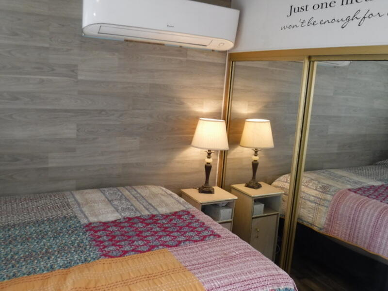 Undisclosed Address Indio, CA 92203 - Photo 19 of 33 a bedroom with a bed and a lamp