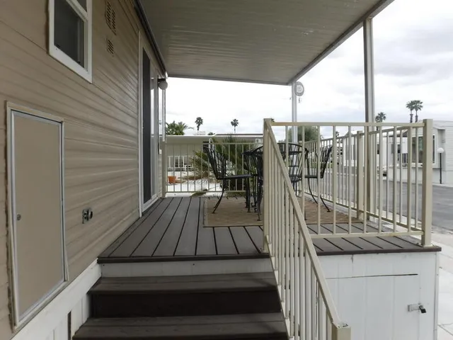 a view of balcony with furniture