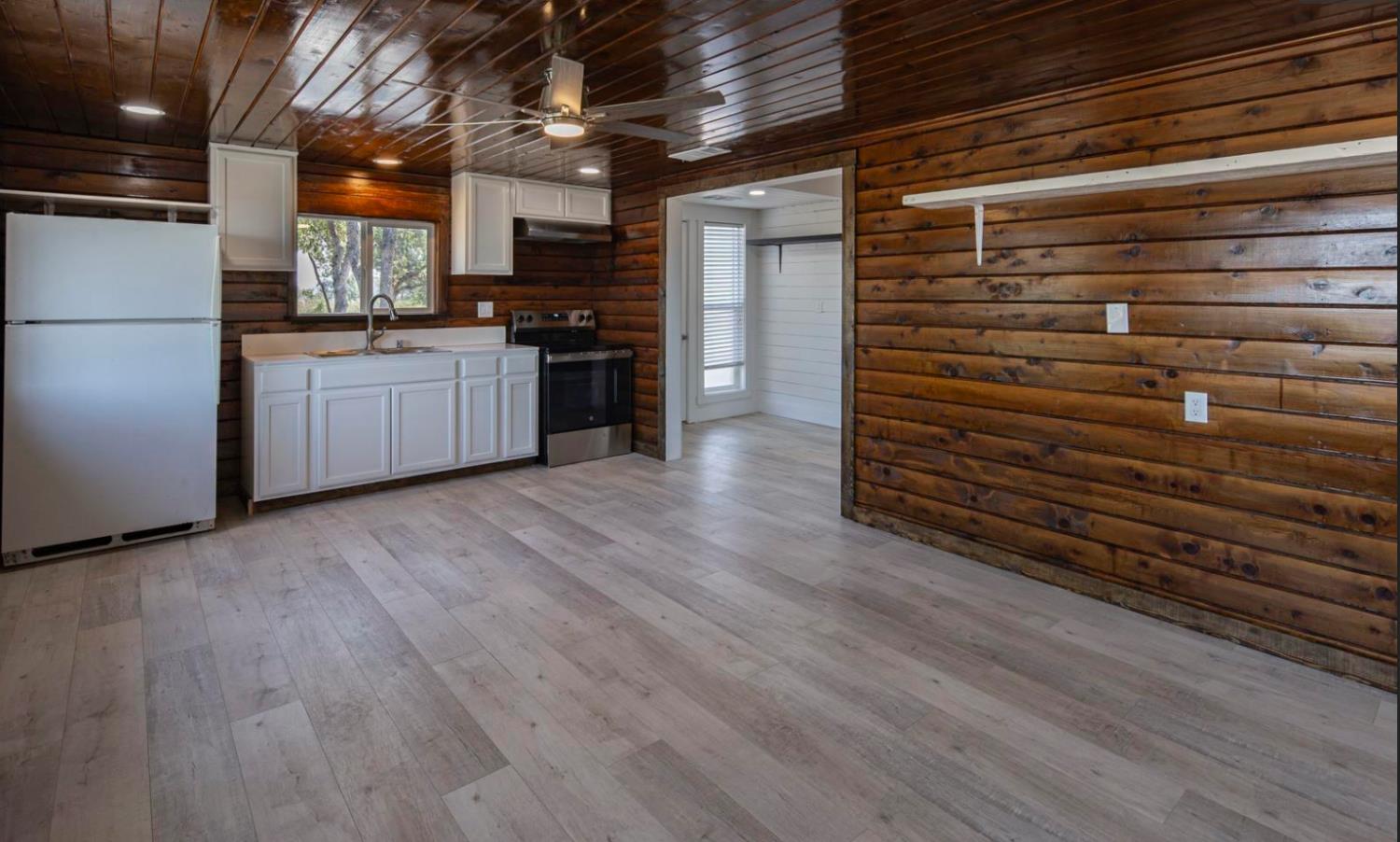 14594 Perricone Road Jamestown, CA 95327 - Photo 11 of 48 a kitchen with stainless steel appliances a refrigerator and a stove top oven