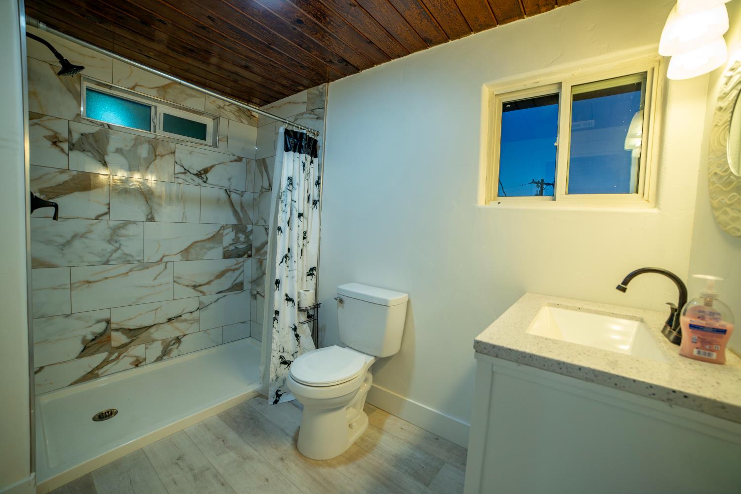 14594 Perricone Road Jamestown, CA 95327 - Photo 14 of 48 a bathroom with a sink a toilet and shower