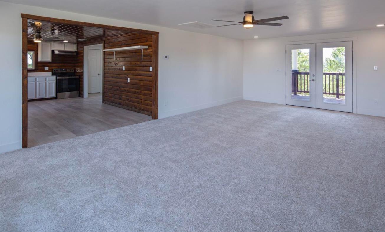 14594 Perricone Road Jamestown, CA 95327 - Photo 18 of 48 an empty room with windows and cabinet