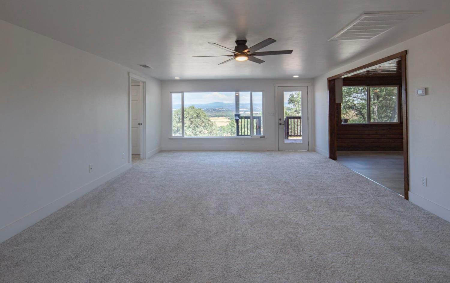 14594 Perricone Road Jamestown, CA 95327 - Photo 19 of 48 a view of an empty room with a window