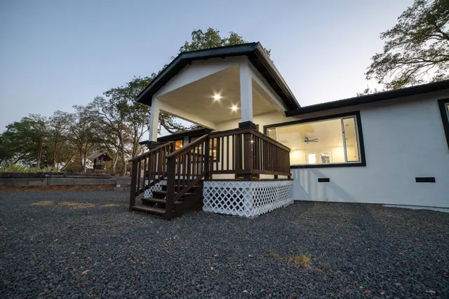 a view of a house with a back yard