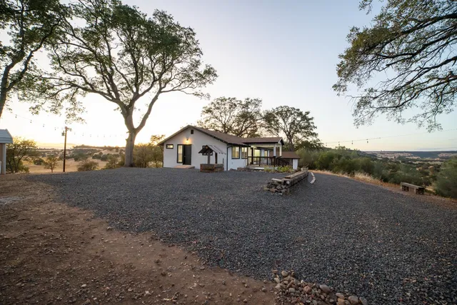 a view of a house with a yard and garage