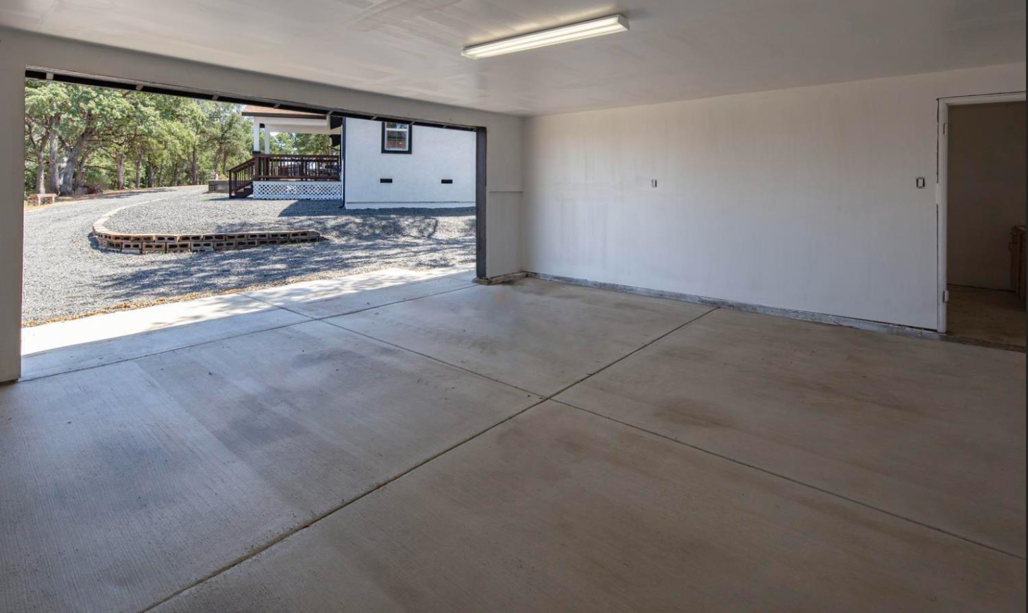 14594 Perricone Road Jamestown, CA 95327 - Photo 35 of 48 a view of a living room hardwood floor and a large window