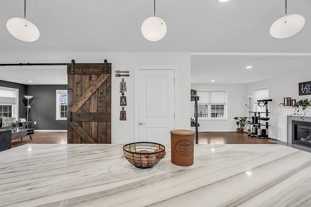 22 Paper Birch Path, Unit 36 Worcester, MA 01605 - Photo 12 of 34 a kitchen with a table and chairs