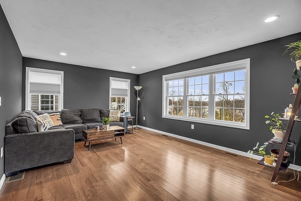 22 Paper Birch Path, Unit 36 Worcester, MA 01605 - Photo 13 of 34 a living room with furniture and a large window