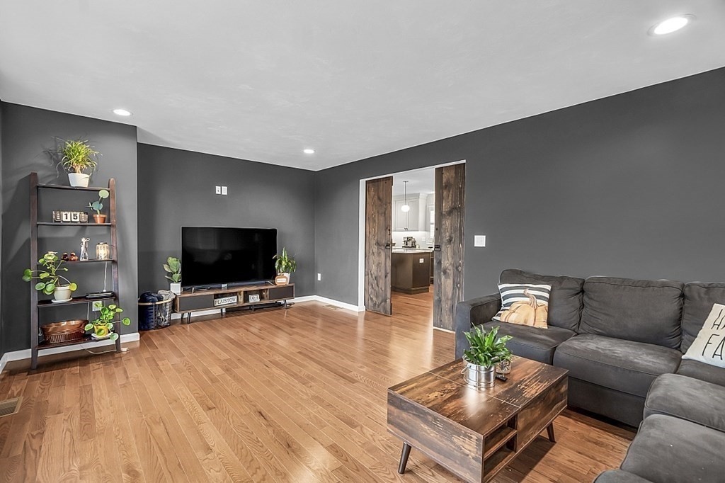 22 Paper Birch Path, Unit 36 Worcester, MA 01605 - Photo 14 of 34 a living room with furniture and a flat screen tv