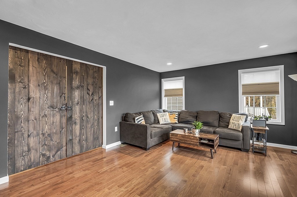 22 Paper Birch Path, Unit 36 Worcester, MA 01605 - Photo 15 of 34 a living room with furniture and a wooden floor