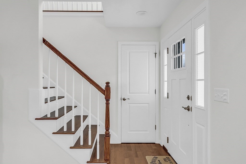 22 Paper Birch Path, Unit 36 Worcester, MA 01605 - Photo 18 of 34 a view of front door with wooden floor and stairs