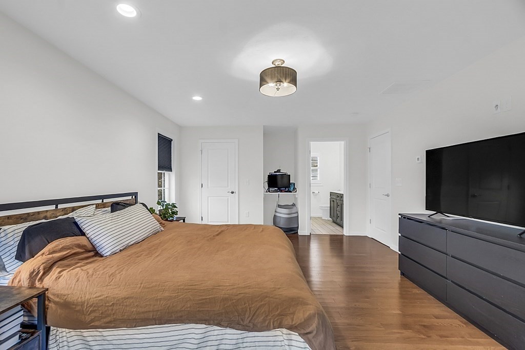 22 Paper Birch Path, Unit 36 Worcester, MA 01605 - Photo 20 of 34 a bedroom with a bed and a flat screen tv