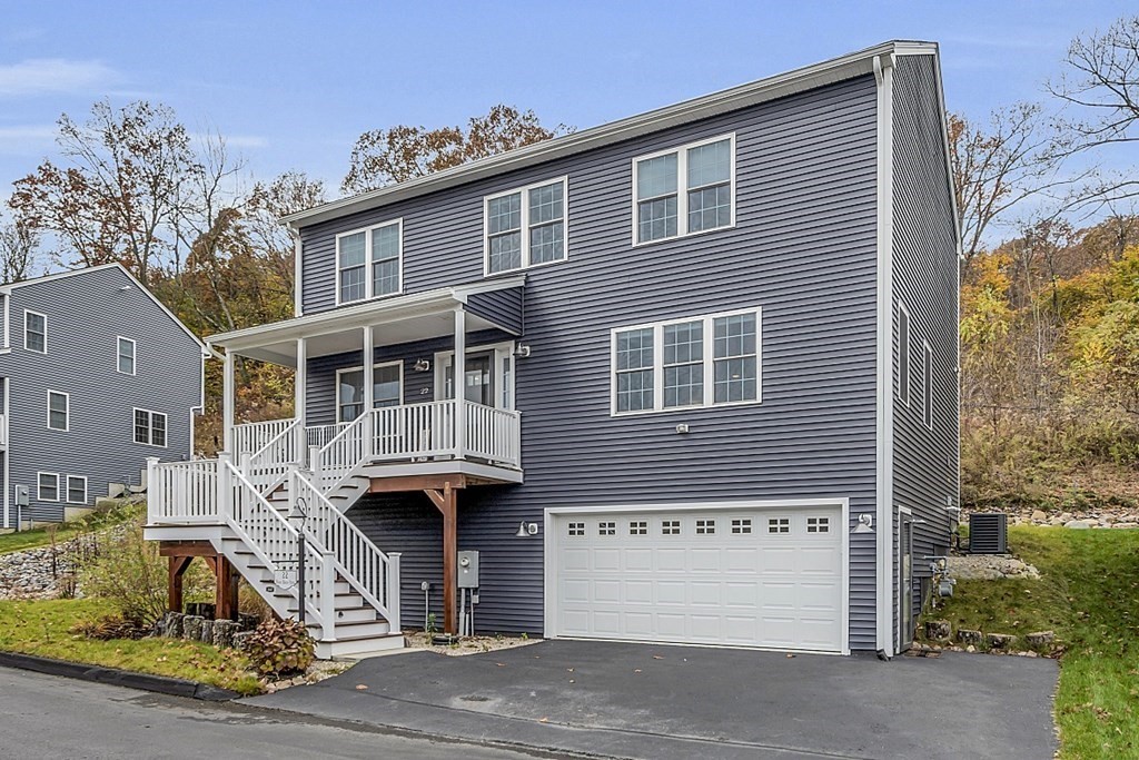 22 Paper Birch Path, Unit 36 Worcester, MA 01605 - Photo 2 of 34 a front view of a house with garden