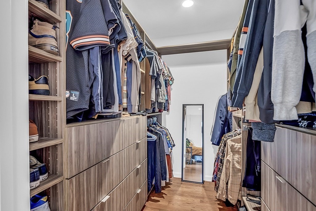 22 Paper Birch Path, Unit 36 Worcester, MA 01605 - Photo 21 of 34 a view of walk in closet with clothes and shoes