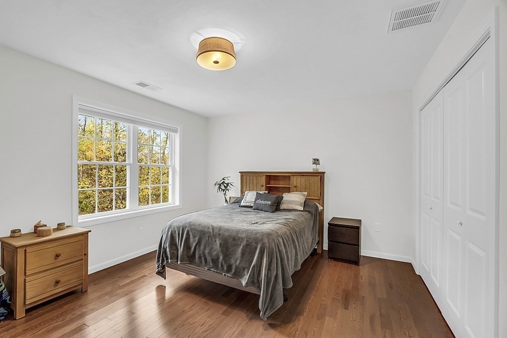 22 Paper Birch Path, Unit 36 Worcester, MA 01605 - Photo 24 of 34 a bedroom with a bed and a window