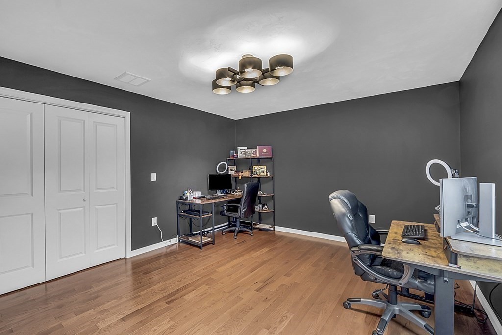 22 Paper Birch Path, Unit 36 Worcester, MA 01605 - Photo 26 of 34 a workspace with furniture and wooden floor