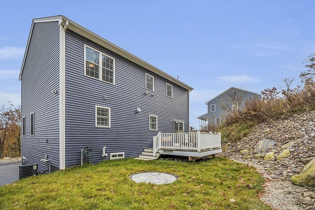 22 Paper Birch Path, Unit 36 Worcester, MA 01605 - Photo 30 of 34 a view of a house with backyard and sitting area