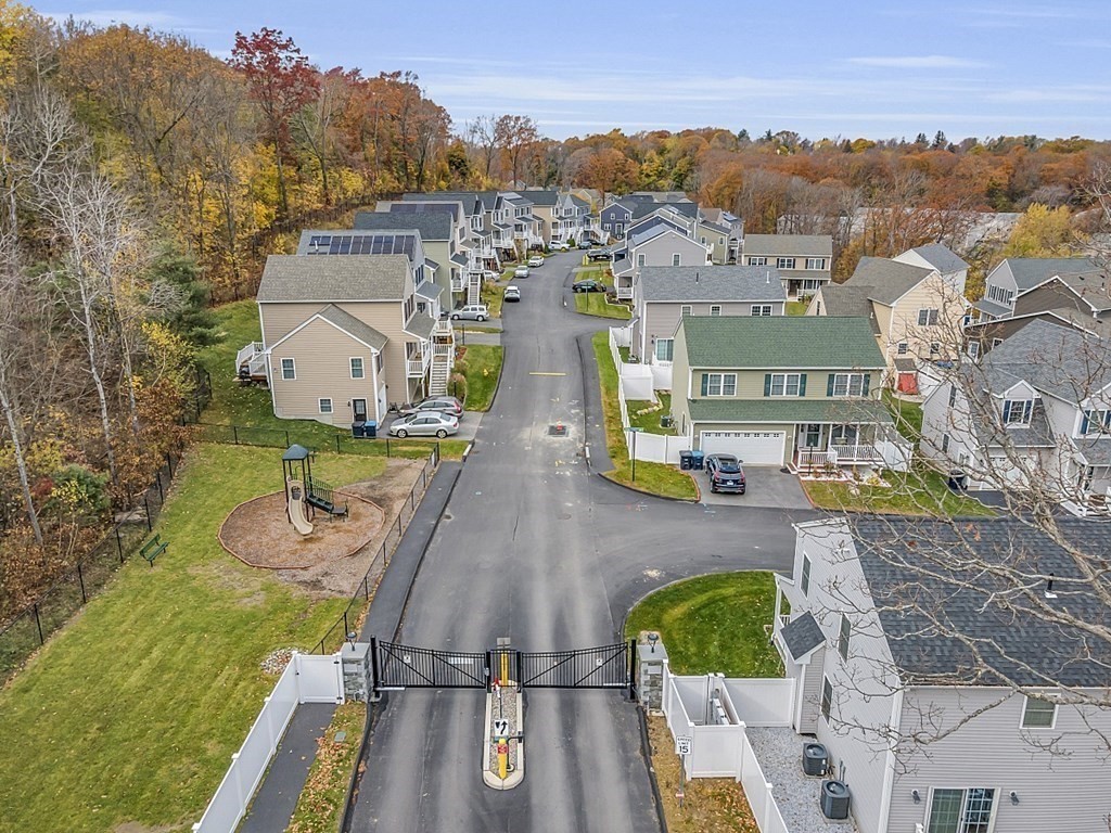 22 Paper Birch Path, Unit 36 Worcester, MA 01605 - Photo 32 of 34 an aerial view of residential houses with outdoor space and parking