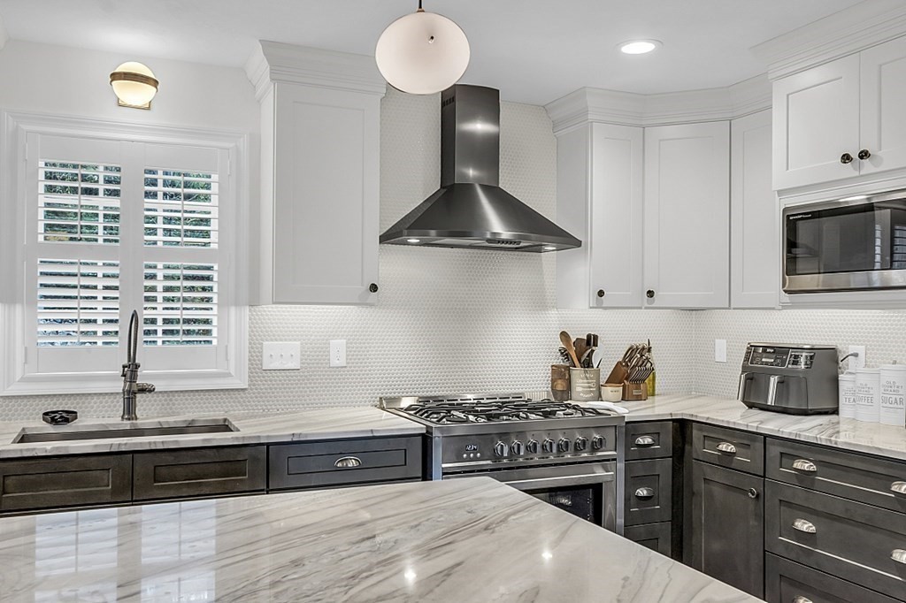 22 Paper Birch Path, Unit 36 Worcester, MA 01605 - Photo 4 of 34 a kitchen with stainless steel appliances a stove a sink a refrigerator and cabinets