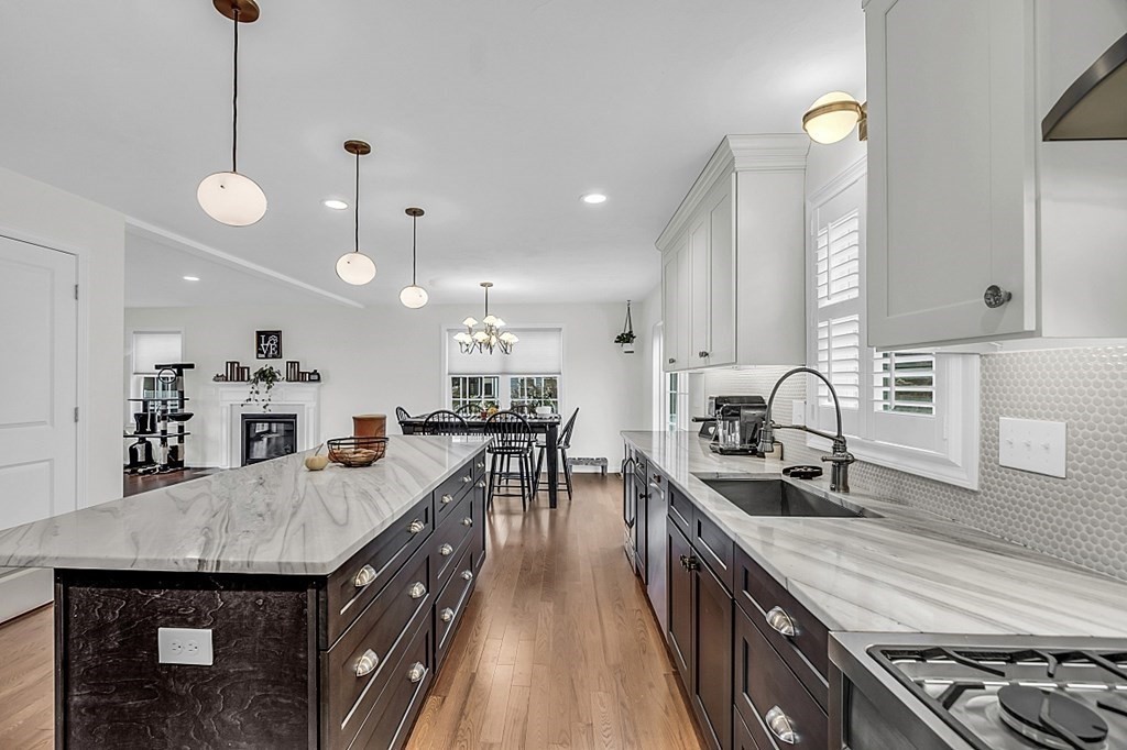 22 Paper Birch Path, Unit 36 Worcester, MA 01605 - Photo 6 of 34 a kitchen with stainless steel appliances granite countertop a sink a stove top oven a counter space and cabinets