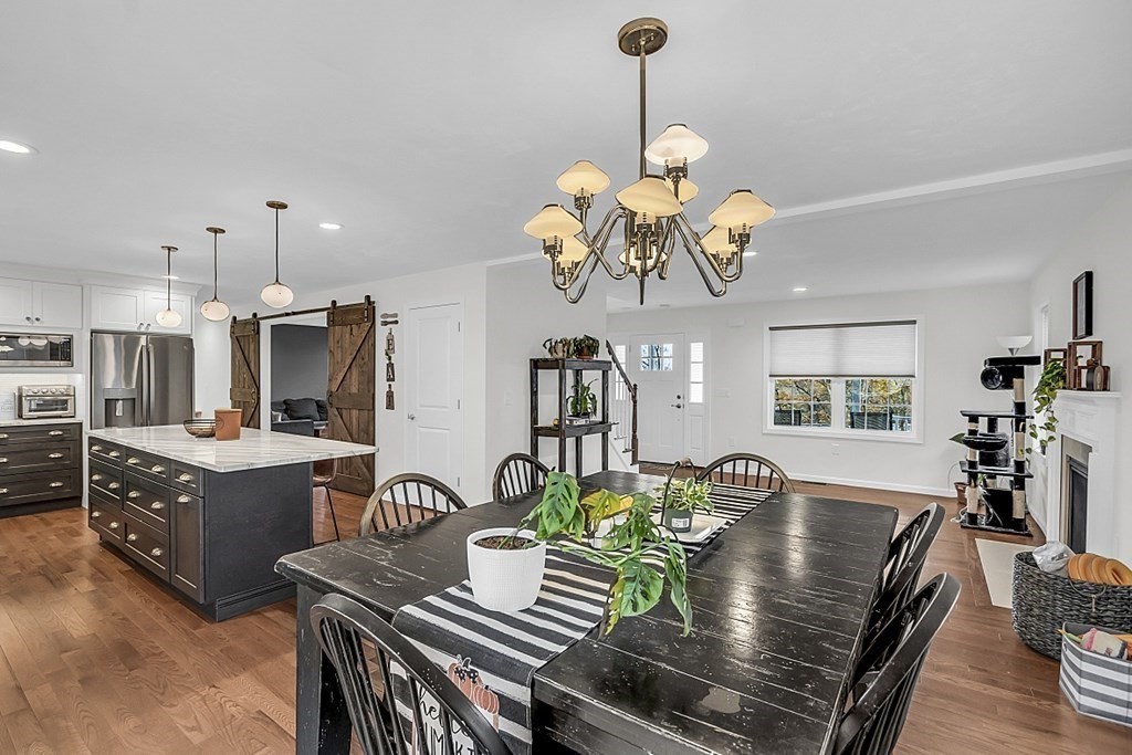 22 Paper Birch Path, Unit 36 Worcester, MA 01605 - Photo 10 of 34 a view of a dining room with furniture a livingroom and chandelier