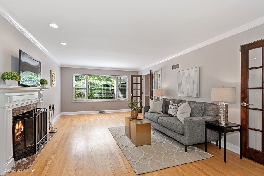 1218 Delles Road Wheaton, IL 60189 - Photo 2 of 6 a living room with furniture and a fireplace