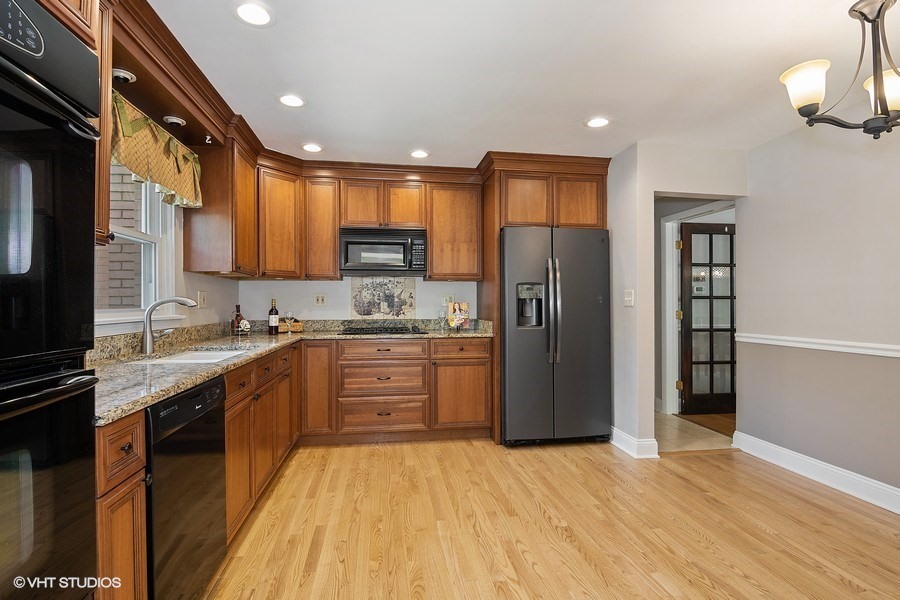 1218 Delles Road Wheaton, IL 60189 - Photo 3 of 6 a open kitchen with stainless steel appliances granite countertop a refrigerator stove and oven
