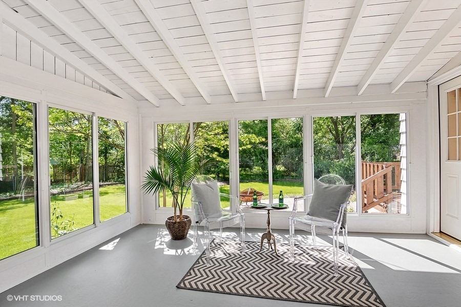 1218 Delles Road Wheaton, IL 60189 - Photo 5 of 6 a living room filled with furniture and a large window