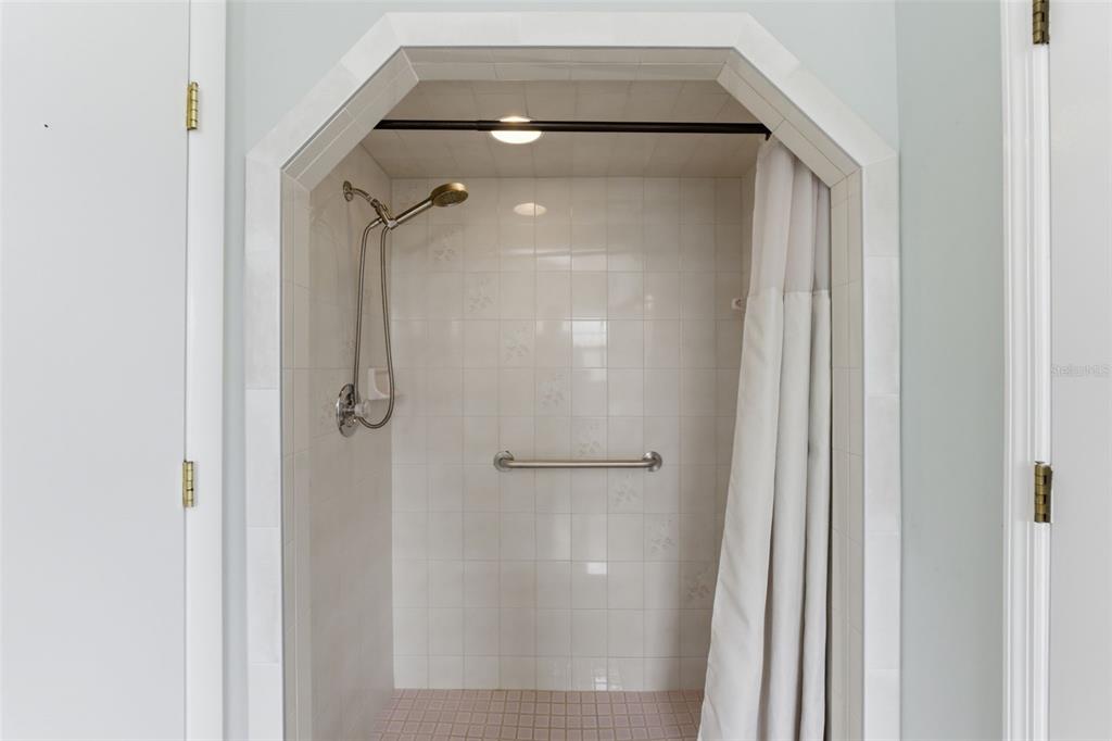4966 Keysville Avenue Spring Hill, FL 34608 - Photo 30 of 48 a bathroom with a glass shower door