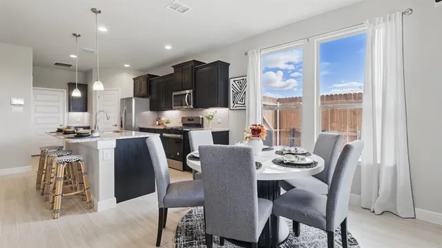 a view of a dining room with furniture window and outside view