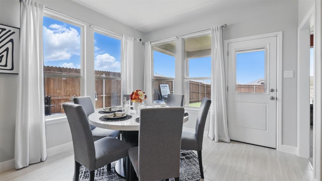 1905 Cherokee Lane Cleburne, TX 76033 - Photo 10 of 39 a dining room with furniture a chandelier and wooden floor
