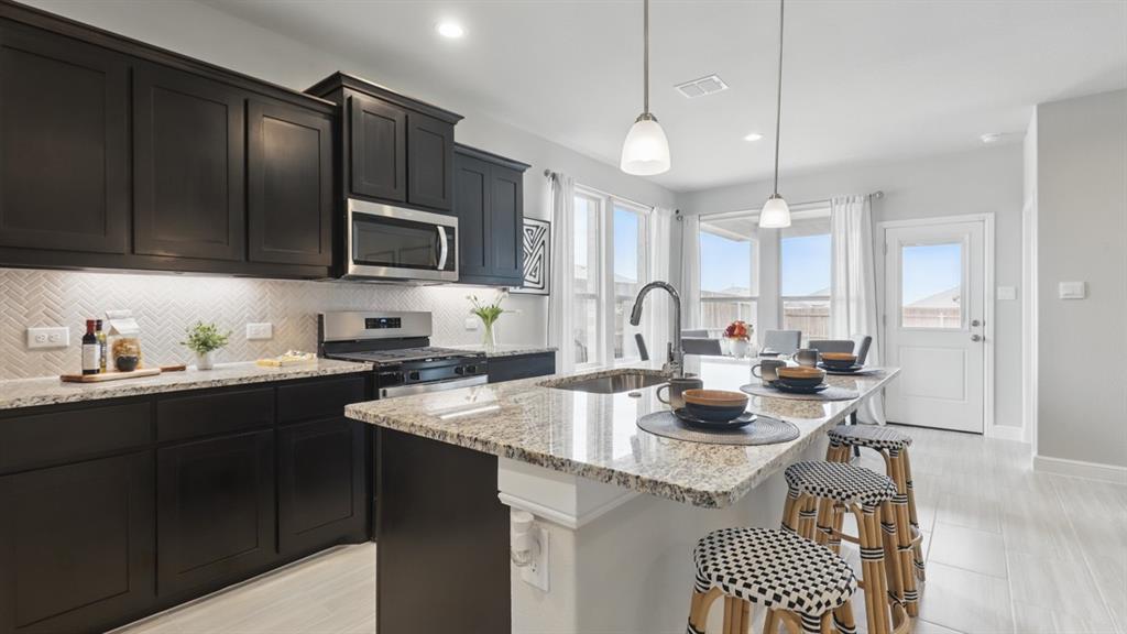 1905 Cherokee Lane Cleburne, TX 76033 - Photo 37 of 39 a kitchen with a sink stove and microwave