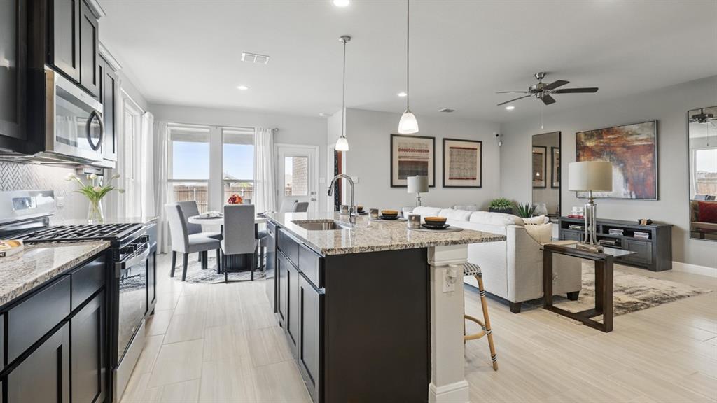 1905 Cherokee Lane Cleburne, TX 76033 - Photo 4 of 39 a kitchen with counter top space a sink appliances and cabinets