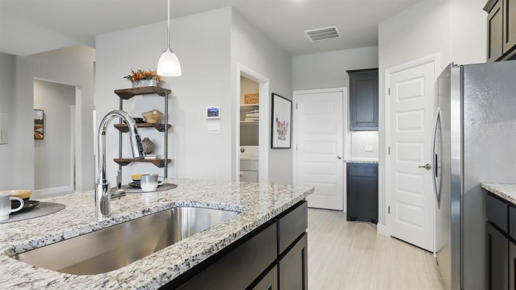 1905 Cherokee Lane Cleburne, TX 76033 - Photo 6 of 39 a bathroom with a granite countertop sink a mirror and shower