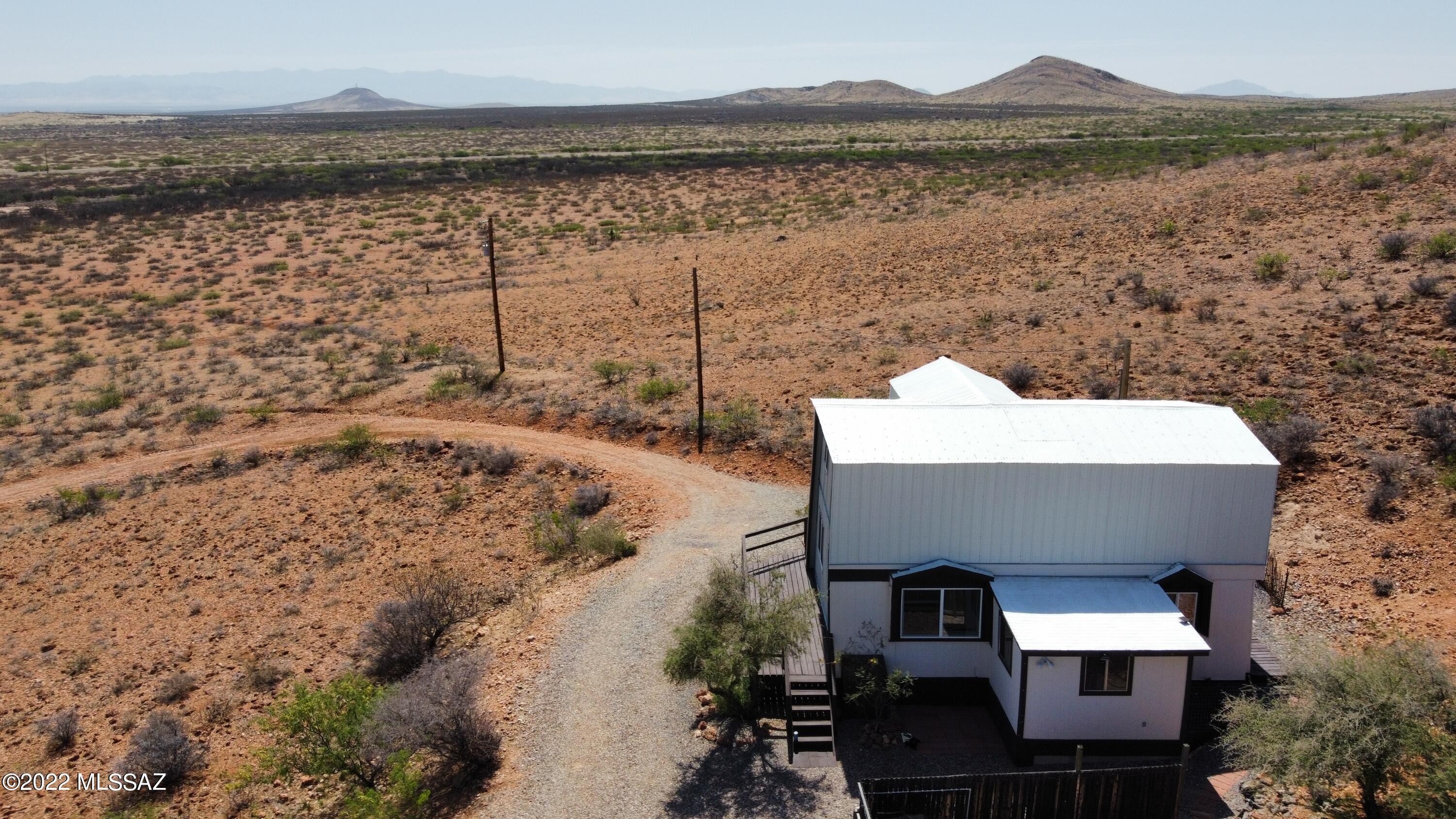 3399 Red Stag Road Pearce, AZ 85625 - Photo 1 of 47 a terrace with a lake view