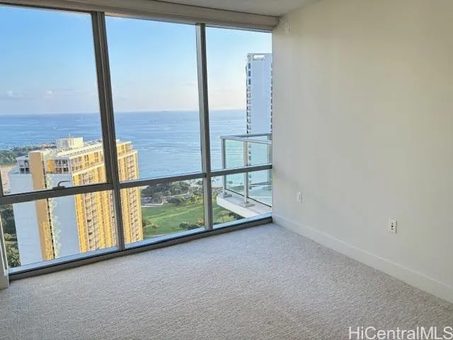 an empty room with large windows