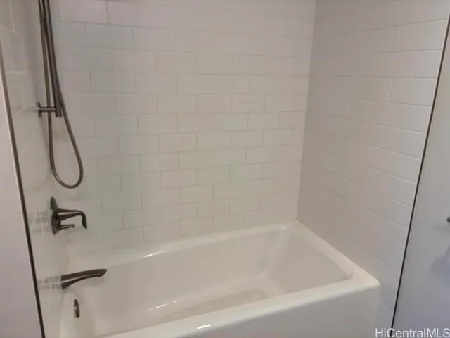 a close view of a bathtub in bathroom