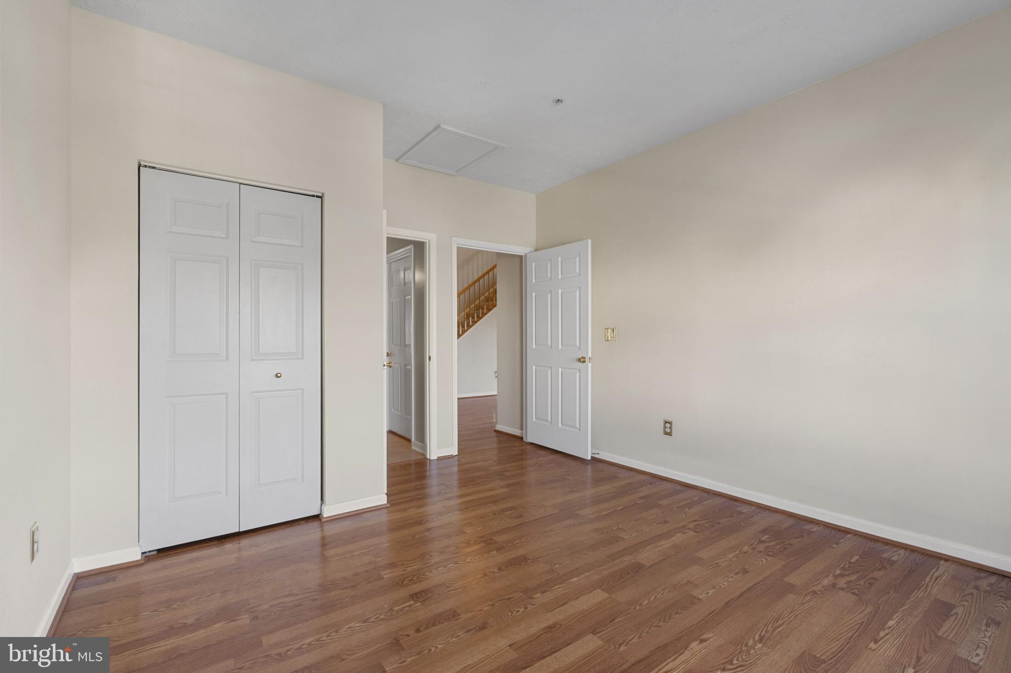 4868 Brightleaf Court, Unit 4868 Rosedale, MD 21237 - Photo 14 of 25 a view of an empty room with wooden floor